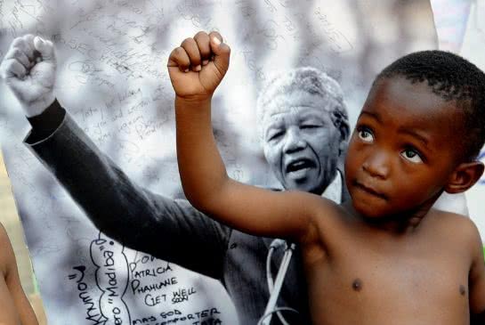 child_imitating_mandela.jpg.size_.xxlarge.promo_